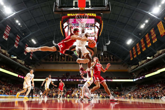Dec 6, 2023; Minneapolis, Minnesota, USA; Nebraska Cornhuskers guard Sam Hoiberg (1) passes while Minnesota Golden Gophers forward Pharrel Payne (21) defends during the first half at Williams Arena.